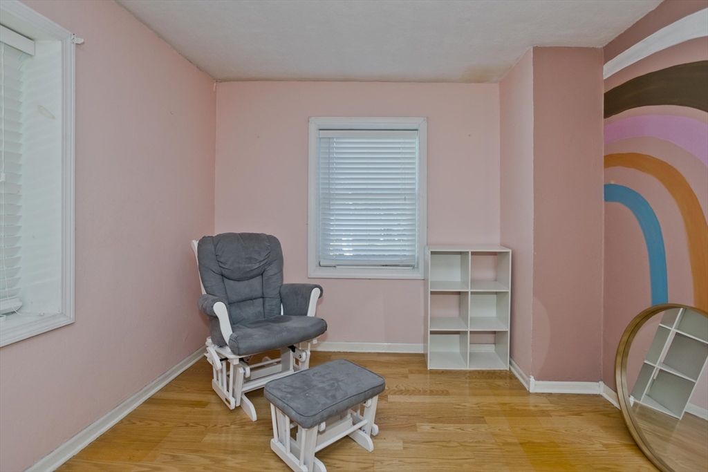 3 Fontaine Street Ludlow, MA 01056 - Photo 23 of 41 a living room with furniture and a chair