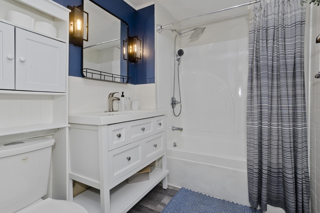 3 Fontaine Street Ludlow, MA 01056 - Photo 28 of 41 a bathroom with a double vanity sink a mirror and shower