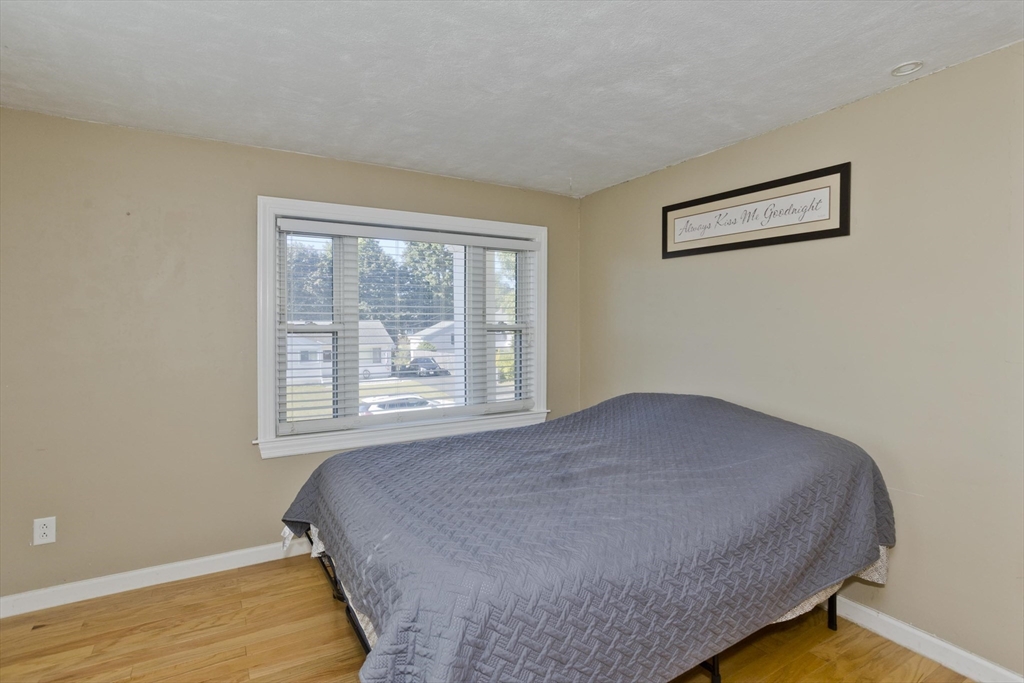 3 Fontaine Street Ludlow, MA 01056 - Photo 30 of 41 a bedroom with a bed and a window