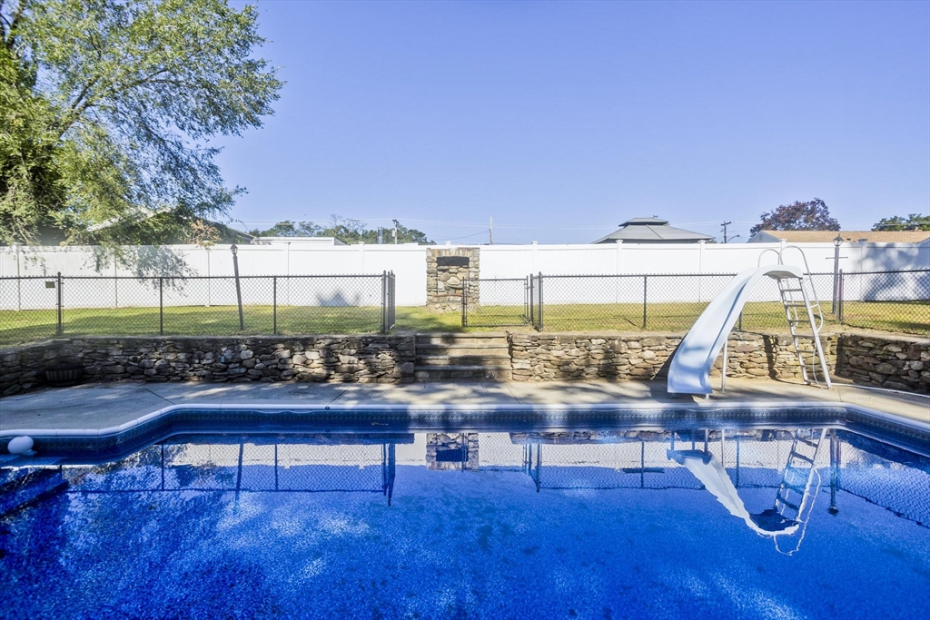 3 Fontaine Street Ludlow, MA 01056 - Photo 41 of 41 a view of a swimming pool with outdoor seating and a yard
