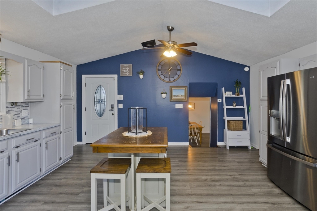 3 Fontaine Street Ludlow, MA 01056 - Photo 9 of 41 a kitchen with stainless steel appliances granite countertop a refrigerator a stove and a wooden floors