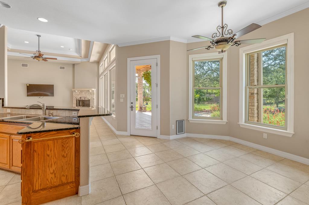 1662 Landmark Kerrville, TX 78028 - Photo 12 of 30 a kitchen with stainless steel appliances granite countertop a stove a sink and a refrigerator