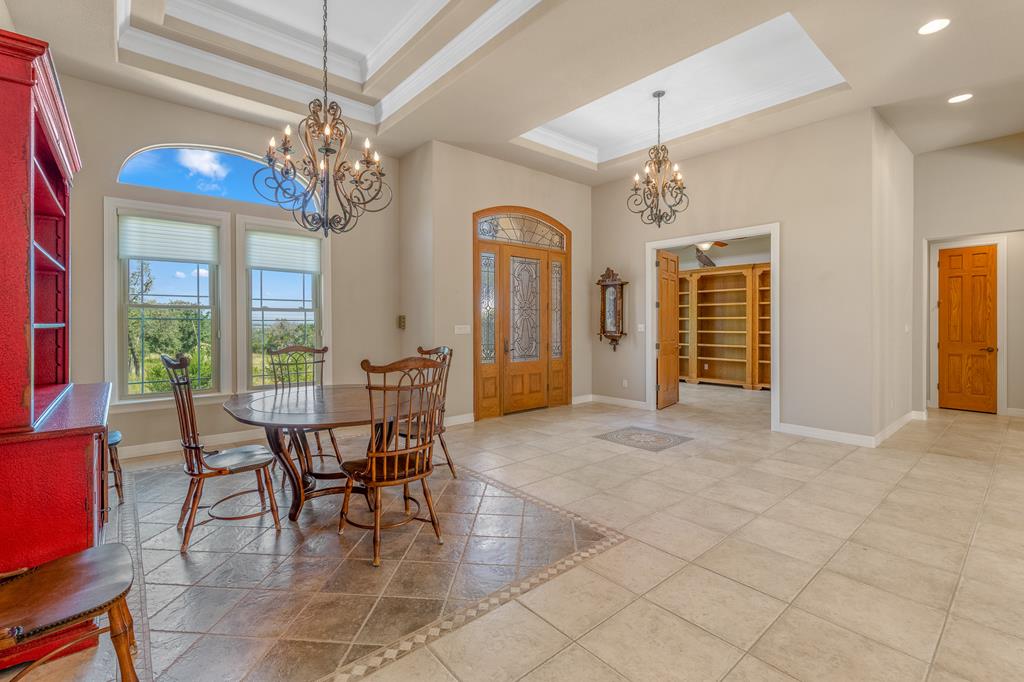 1662 Landmark Kerrville, TX 78028 - Photo 15 of 30 a view of a dining room with furniture a chandelier and window