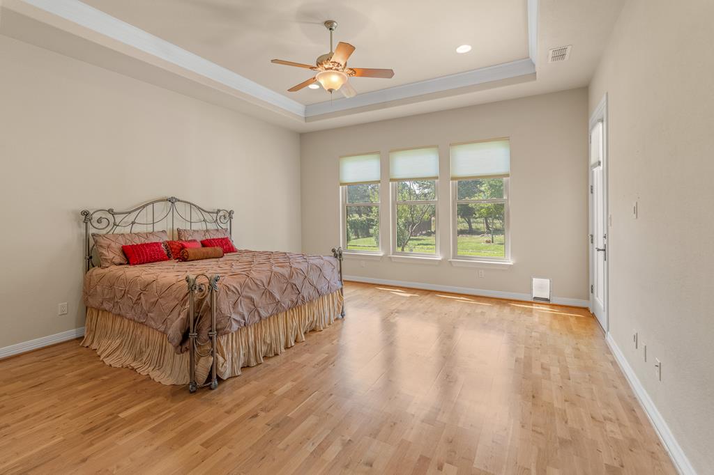 1662 Landmark Kerrville, TX 78028 - Photo 17 of 30 a spacious bedroom with a bed and a window