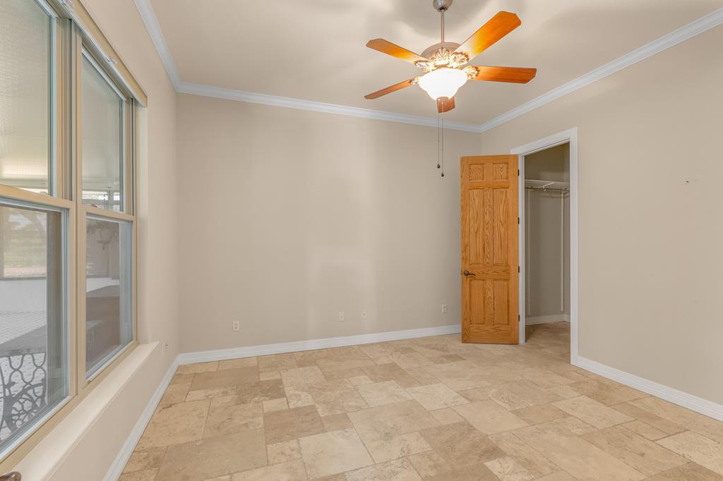 1662 Landmark Kerrville, TX 78028 - Photo 20 of 30 an empty room with closet and a chandelier fan