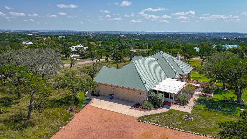 1662 Landmark Kerrville, TX 78028 - Photo 2 of 30 an aerial view of a house with a garden and lake view