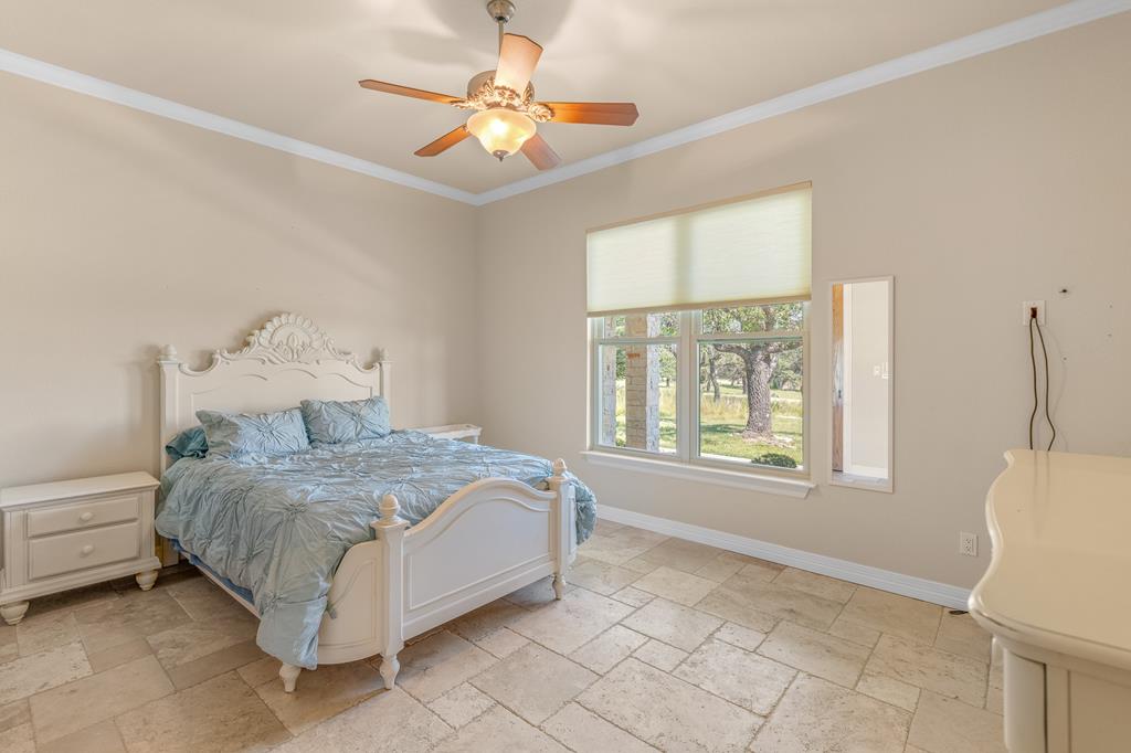 1662 Landmark Kerrville, TX 78028 - Photo 22 of 30 a spacious bedroom with a bed and a window