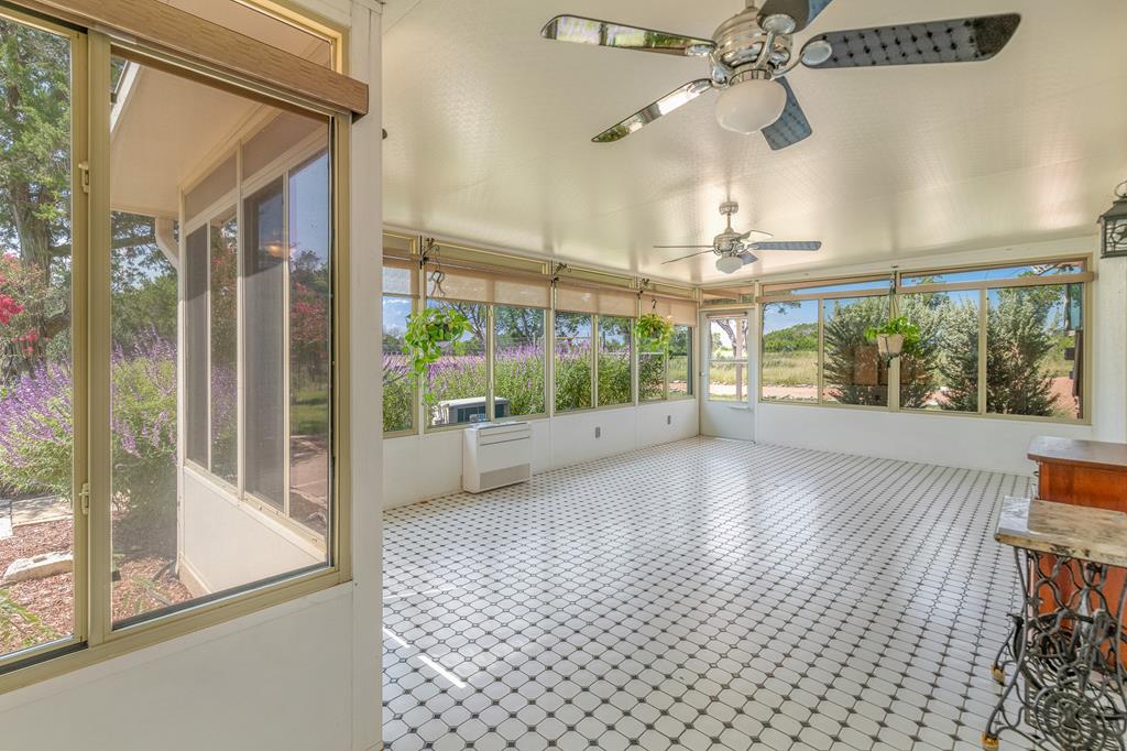 1662 Landmark Kerrville, TX 78028 - Photo 24 of 30 a view of a room with a large window and chandelier