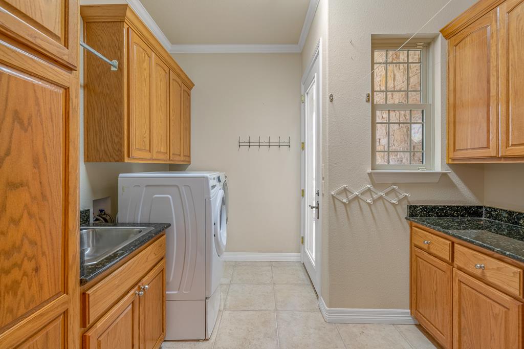 1662 Landmark Kerrville, TX 78028 - Photo 27 of 30 a kitchen with granite countertop a sink stove and refrigerator