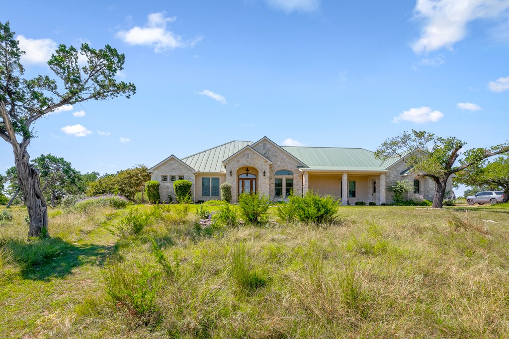 1662 Landmark Kerrville, TX 78028 - Photo 8 of 30 a front view of a house with a yard and garage