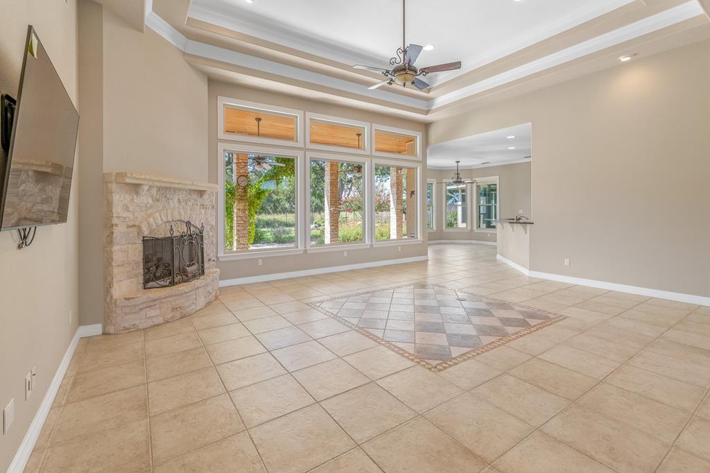 1662 Landmark Kerrville, TX 78028 - Photo 9 of 30 a view of an empty room with a fireplace and a window