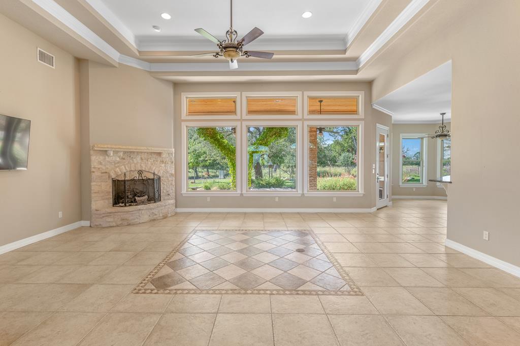 1662 Landmark Kerrville, TX 78028 - Photo 10 of 30 a view of an empty room with a fireplace and a window