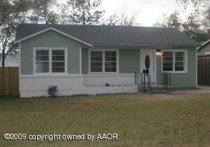 1709 Clarence Street Amarillo, TX 79110 - Photo 1 of 10 front view of a house with a yard