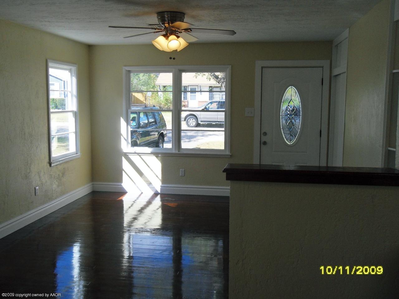 1709 Clarence Street Amarillo, TX 79110 - Photo 3 of 10 a view of livingroom with furniture wooden floor and window