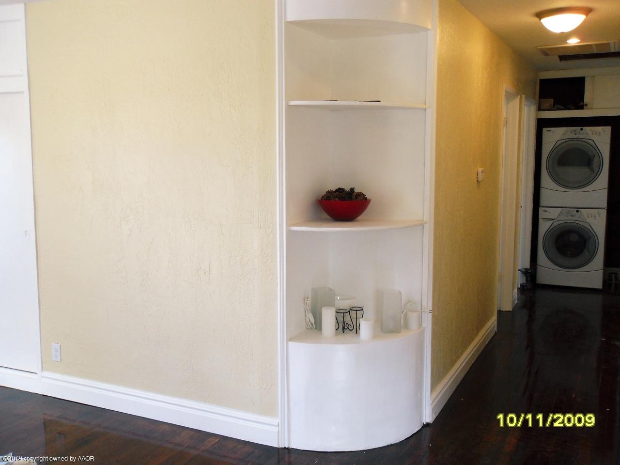 1709 Clarence Street Amarillo, TX 79110 - Photo 4 of 10 a view of a hallway with washer and dryer