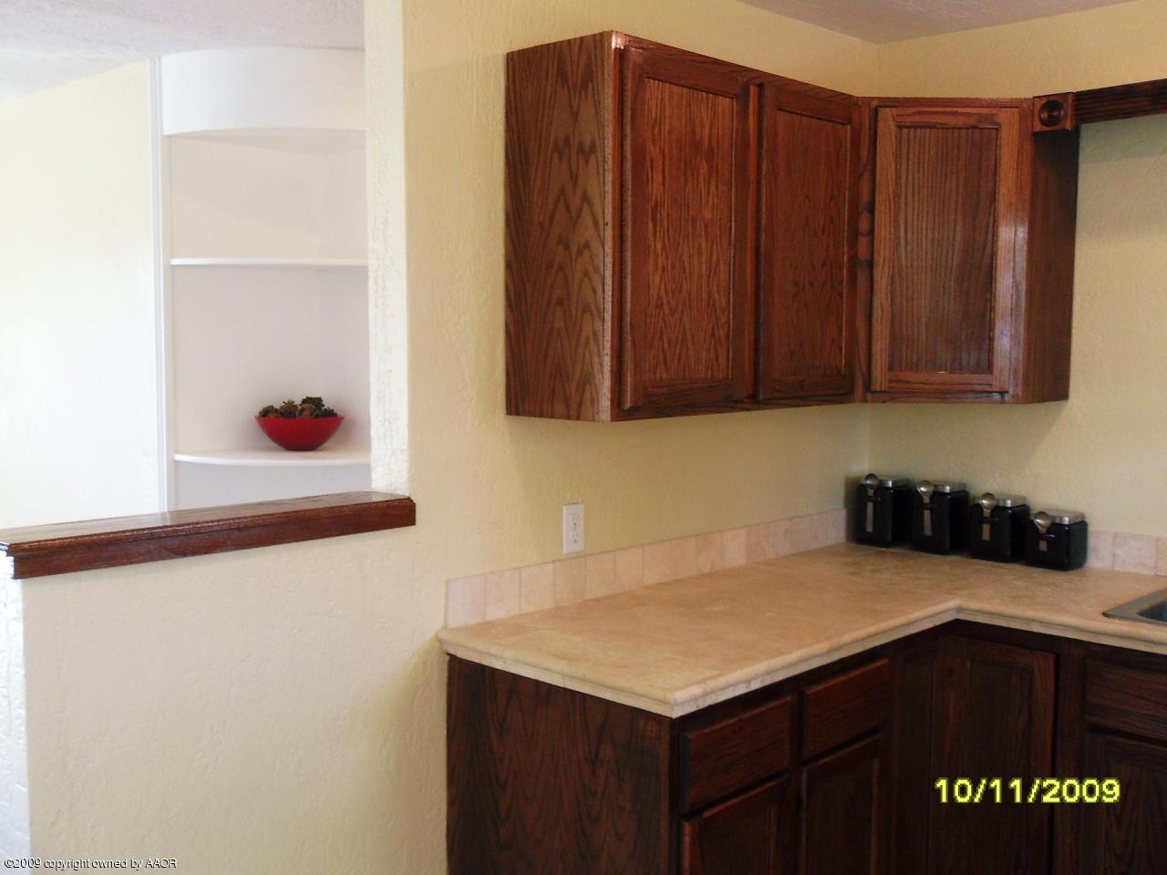 1709 Clarence Street Amarillo, TX 79110 - Photo 6 of 10 a kitchen with a sink and cabinets