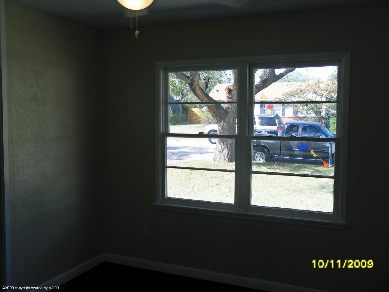 1709 Clarence Street Amarillo, TX 79110 - Photo 10 of 10 a view of empty room with wooden floor and fan