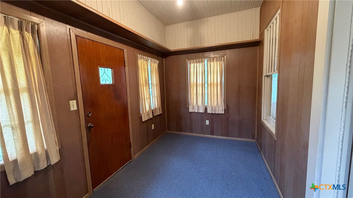 701 East 10th Street Cameron, TX 76520 - Photo 11 of 19 a view of a hallway with a glass door