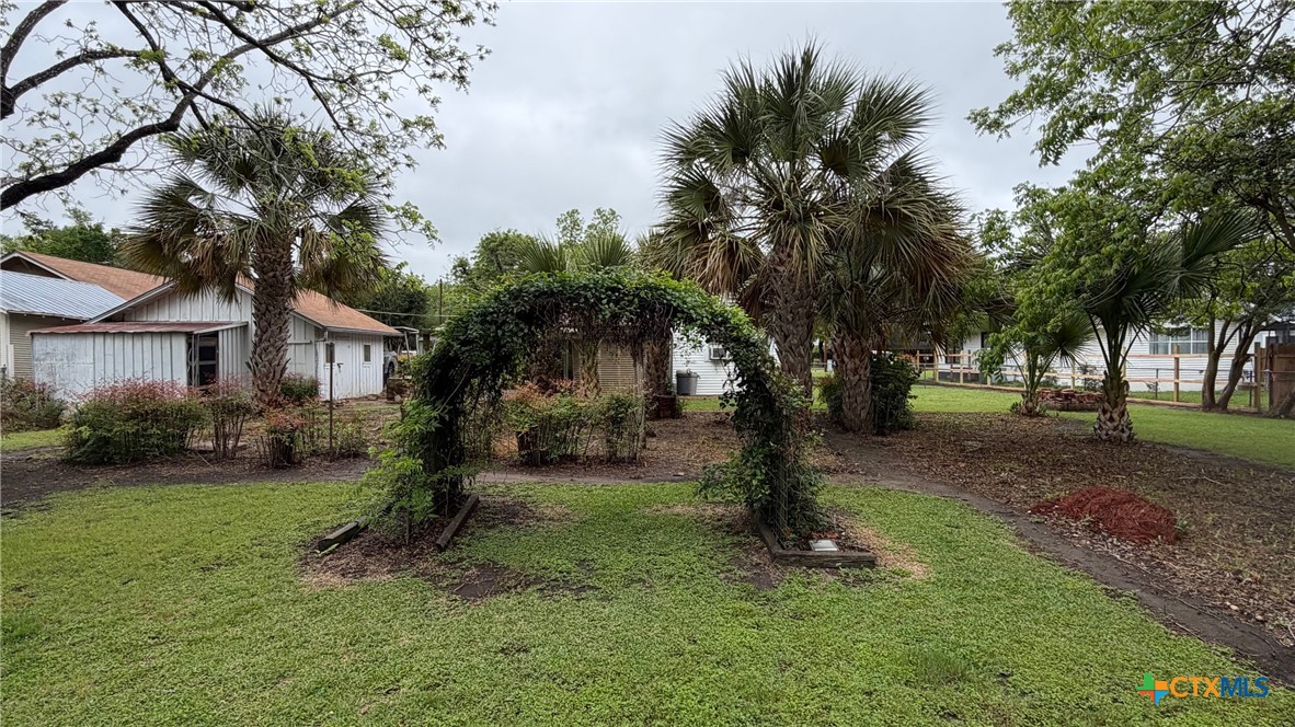 701 East 10th Street Cameron, TX 76520 - Photo 15 of 19 a front view of a house with a yard and tree