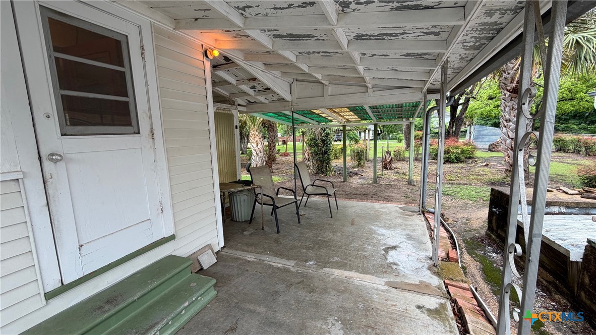 701 East 10th Street Cameron, TX 76520 - Photo 19 of 19 a view of a porch with furniture and floor to ceiling window