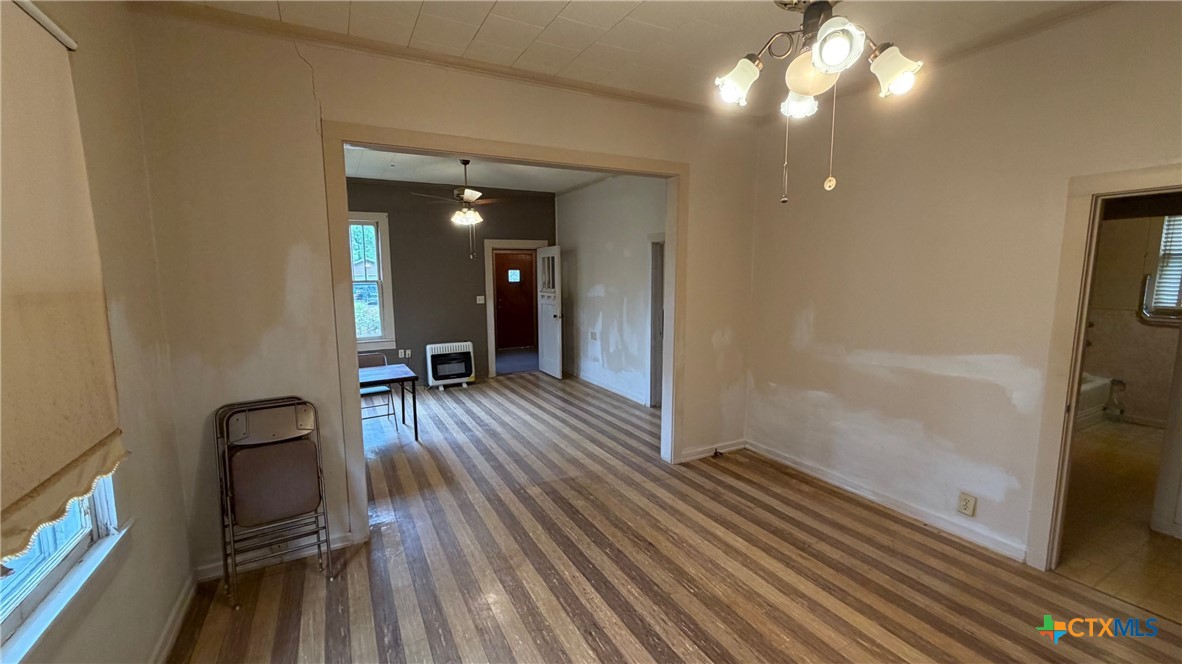 701 East 10th Street Cameron, TX 76520 - Photo 5 of 19 a view of a room with wooden floor