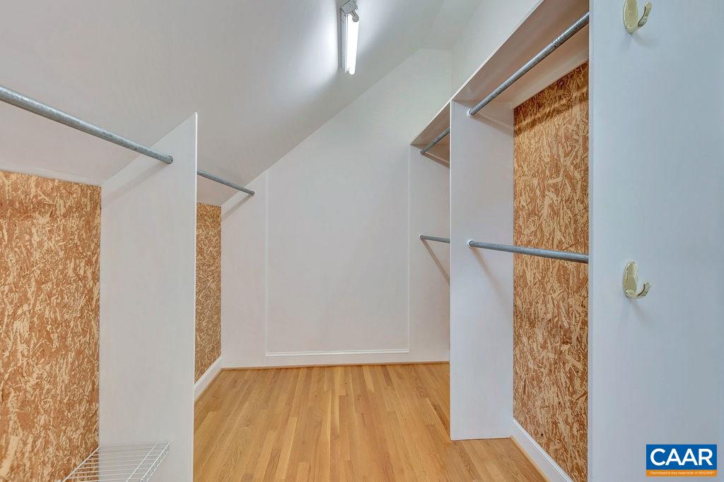 1861 Field Road Charlottesville, VA 22903 - Photo 31 of 49 a view of walk in closet with wooden floor