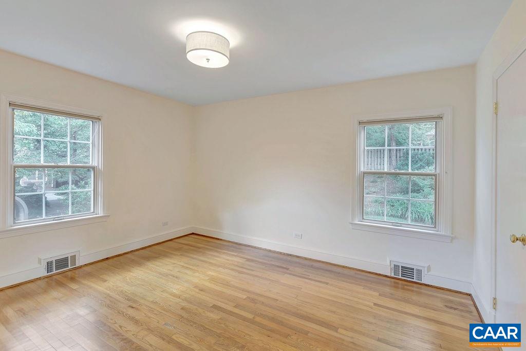 1861 Field Road Charlottesville, VA 22903 - Photo 36 of 49 a view of an empty room with wooden floor and a window