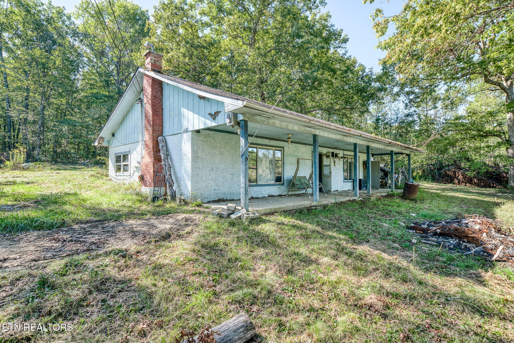 1602 Hollis Poore Road Jamestown, TN 38556 - Photo 13 of 25 a backyard of a house with lots of green space