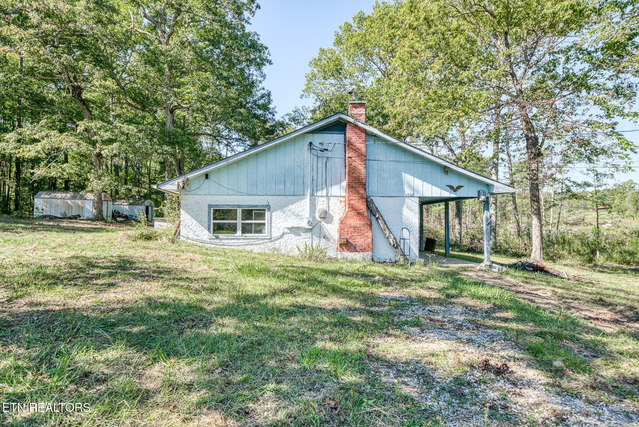 1602 Hollis Poore Road Jamestown, TN 38556 - Photo 16 of 25 a view of a house with a yard
