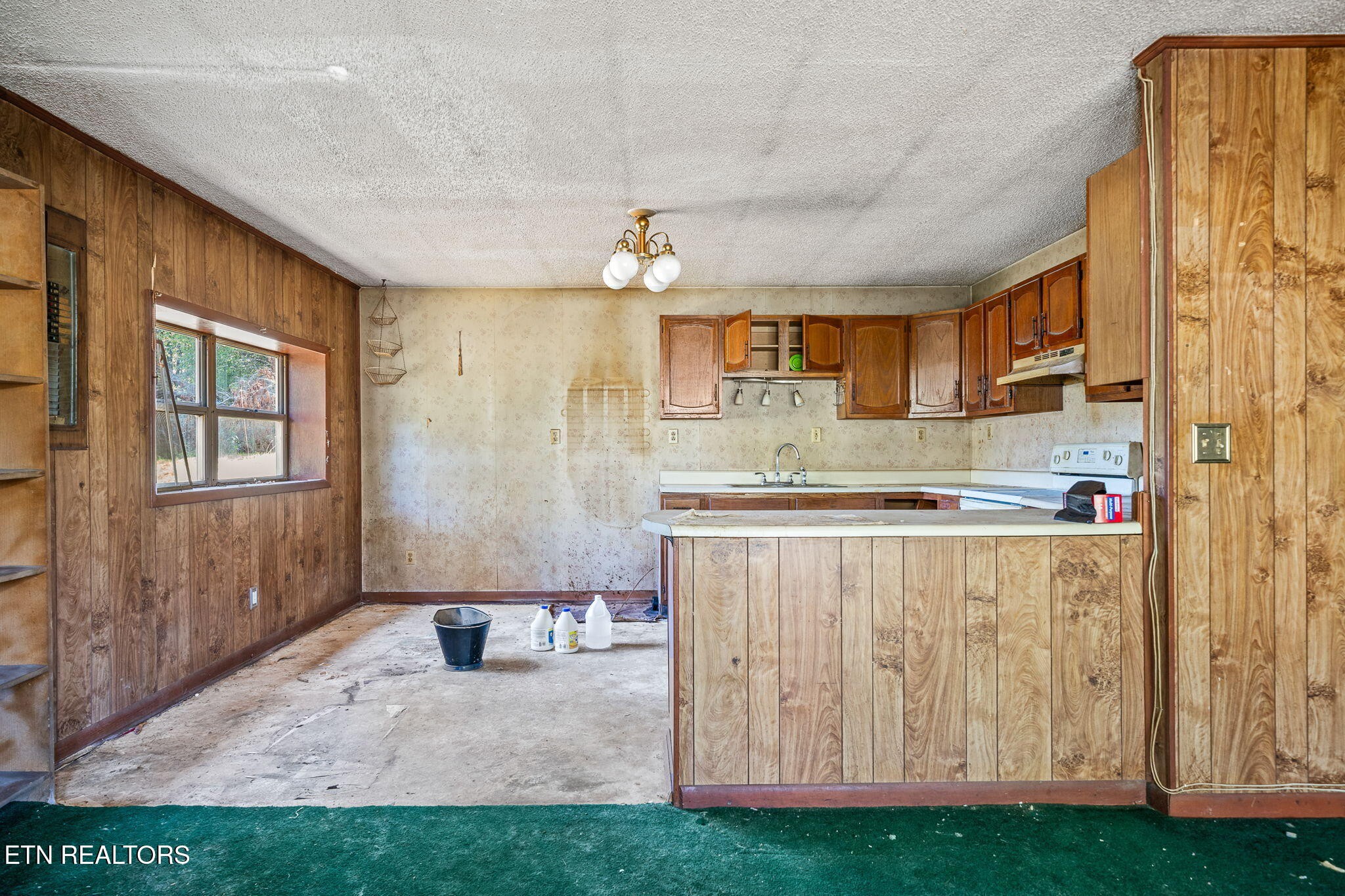 1602 Hollis Poore Road Jamestown, TN 38556 - Photo 6 of 25 a kitchen with kitchen island a counter top space cabinets and stainless steel appliances