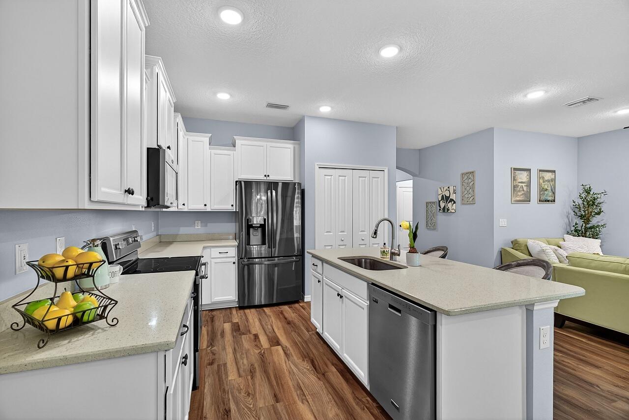 313 Sandcrest Circle Sebastian, FL 32958 - Photo 13 of 42 a kitchen with a sink appliances and cabinets