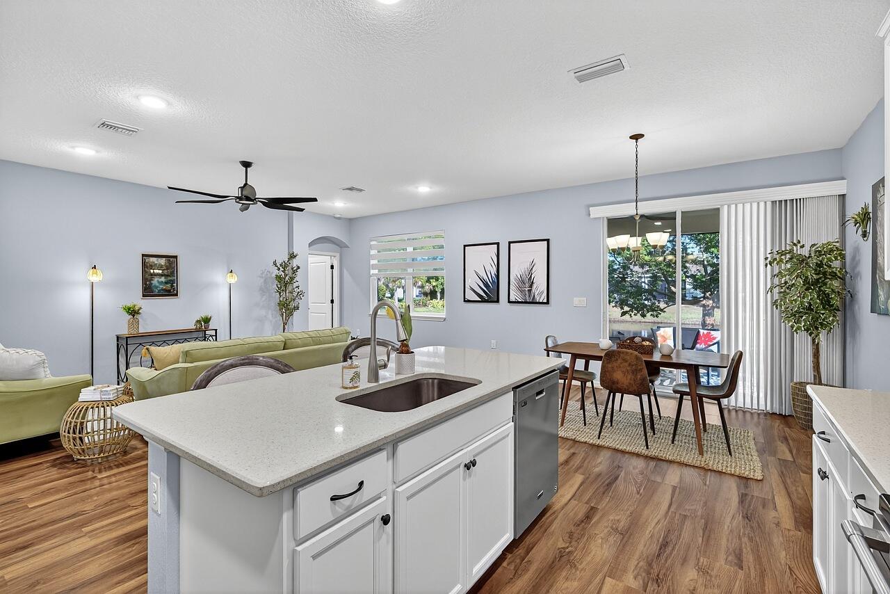 313 Sandcrest Circle Sebastian, FL 32958 - Photo 14 of 42 a view of a dining room with furniture window and wooden floor