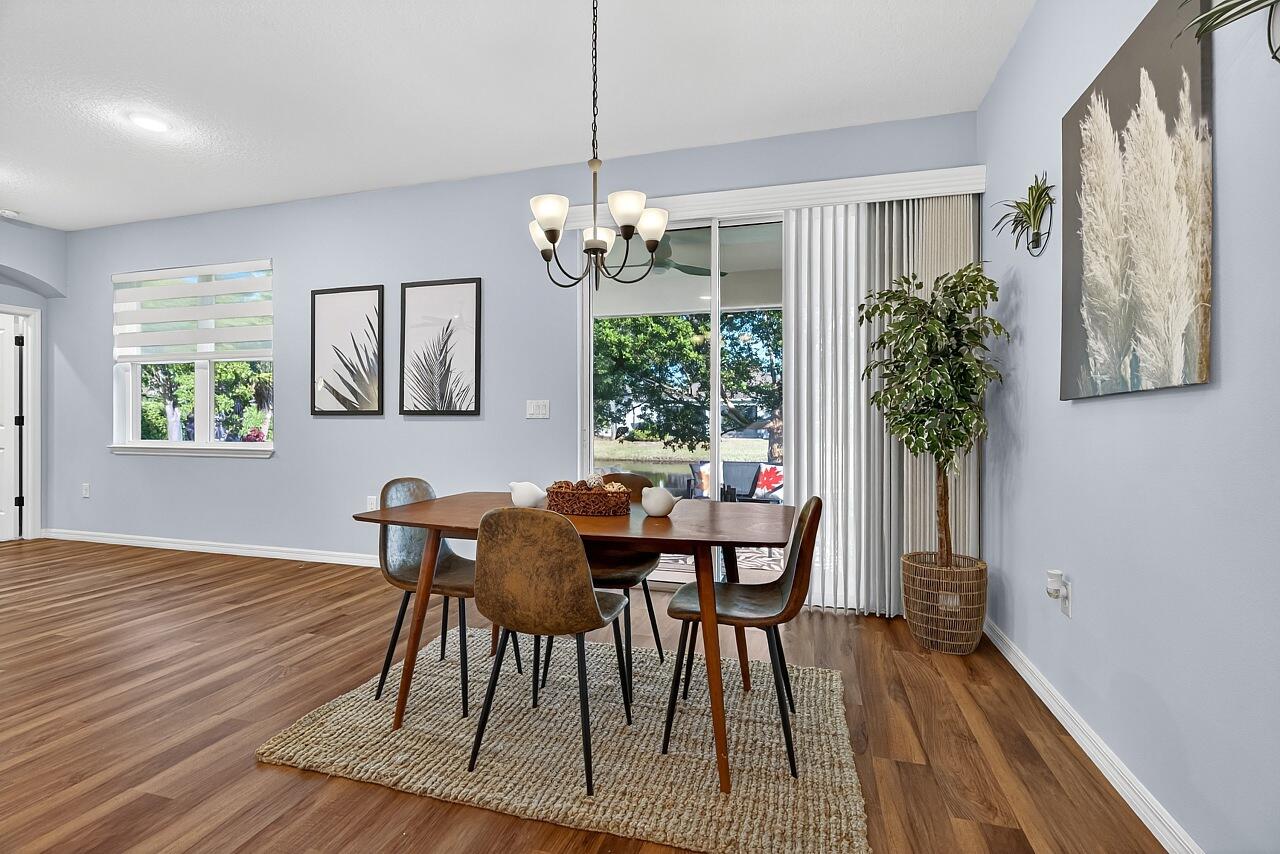 313 Sandcrest Circle Sebastian, FL 32958 - Photo 16 of 42 a view of a dining room with furniture window and wooden floor