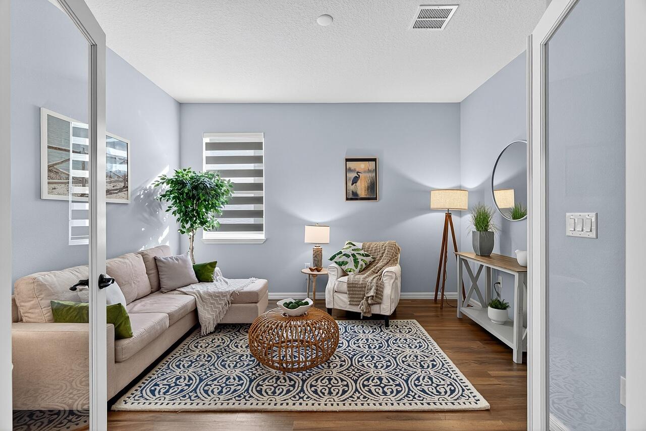 313 Sandcrest Circle Sebastian, FL 32958 - Photo 18 of 42 a living room with furniture and a rug