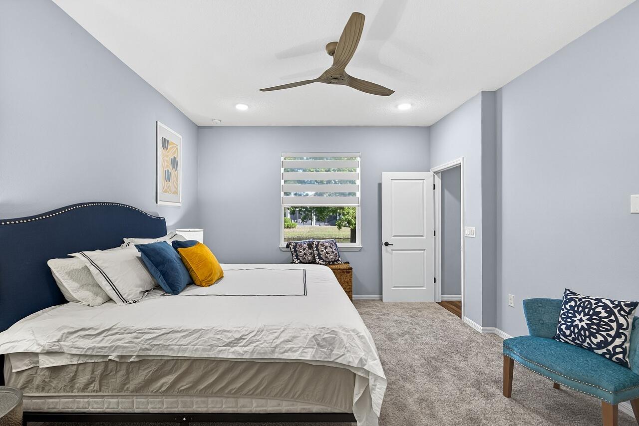 313 Sandcrest Circle Sebastian, FL 32958 - Photo 22 of 42 a bedroom with a bed and a couch