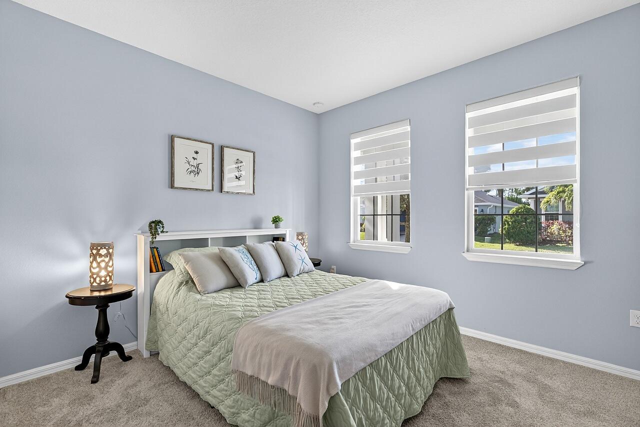 313 Sandcrest Circle Sebastian, FL 32958 - Photo 29 of 42 a bedroom with a bed and a window