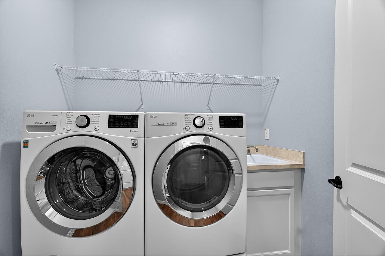 313 Sandcrest Circle Sebastian, FL 32958 - Photo 31 of 42 a utility room with dryer and washer