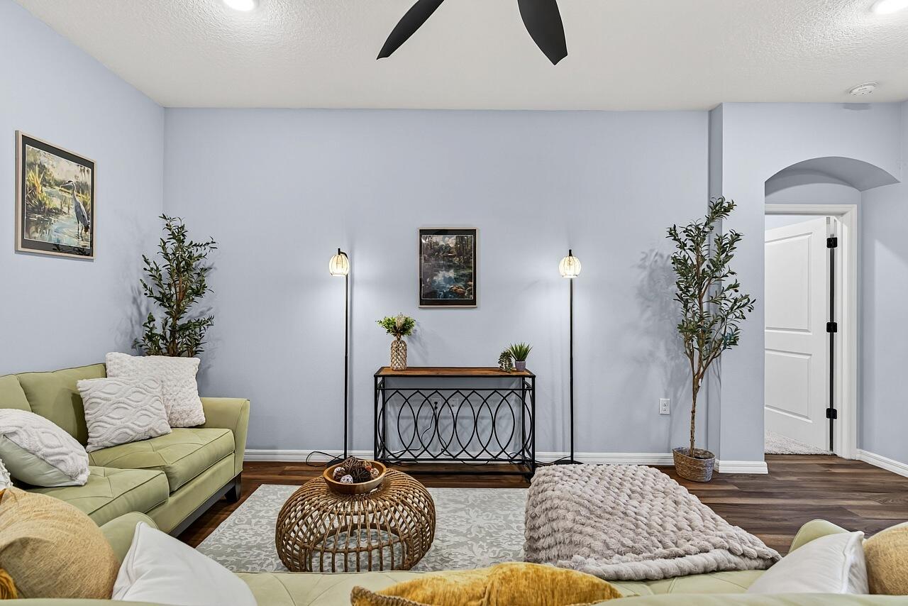 313 Sandcrest Circle Sebastian, FL 32958 - Photo 9 of 42 a living room with furniture and a potted plant