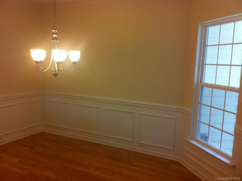 4266 Perth Road, Unit 311 Indian Land, SC 29707 - Photo 2 of 12 a view of a room with wooden floor and windows