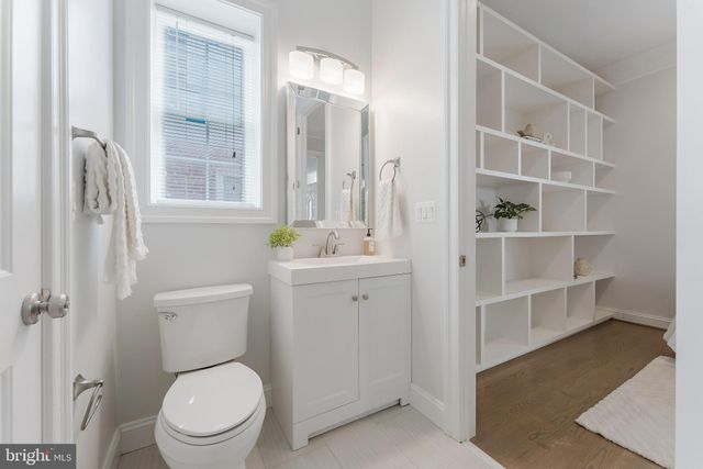 a bathroom with a toilet a sink and shower