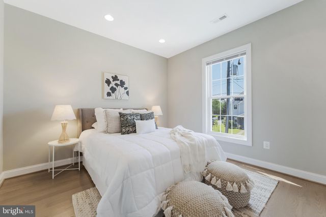 a bedroom with bed and a window