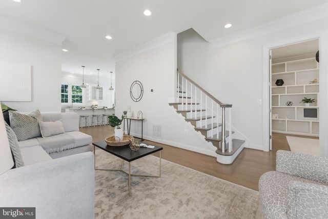 a living room with furniture and white walls