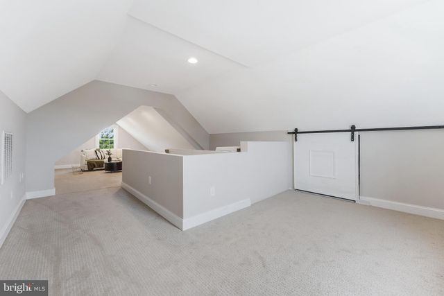 a view of a livingroom and a hallway