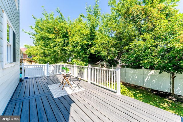 a balcony with wooden floor in front of it