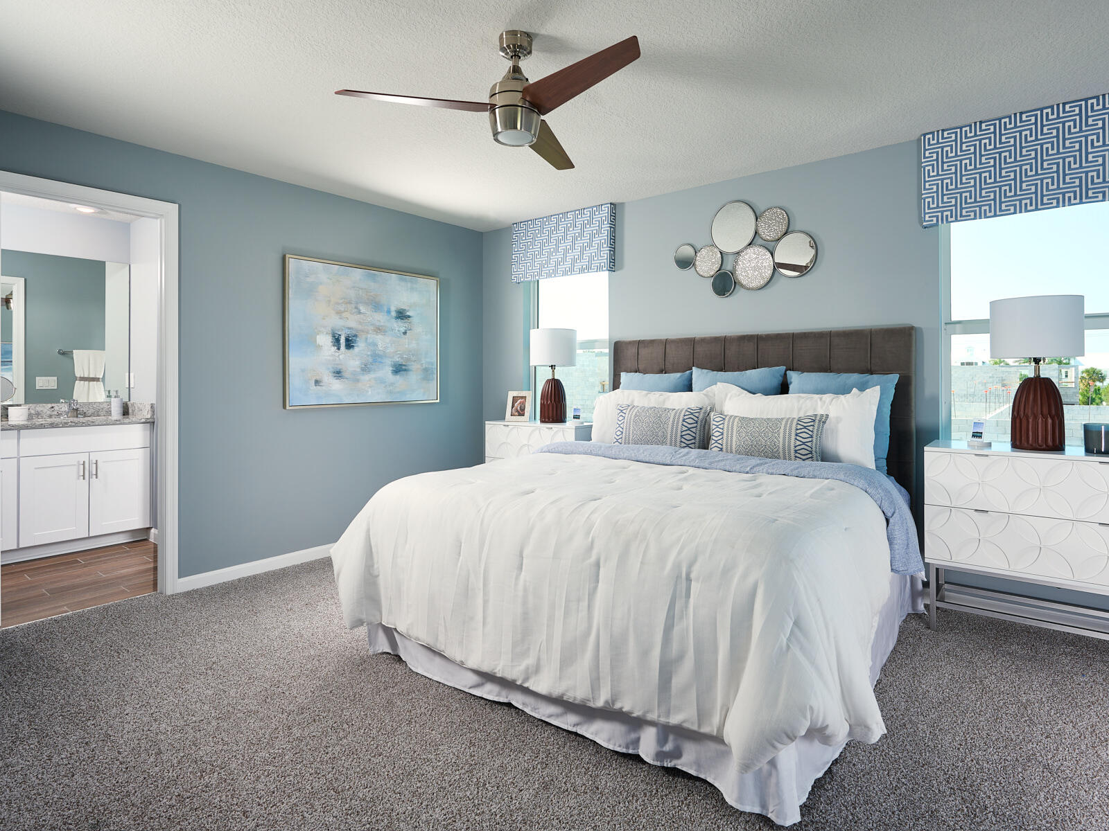 574 Salisbury Circle Fort Pierce, FL 34982 - Photo 7 of 10 a bedroom with a large bed and a chandelier