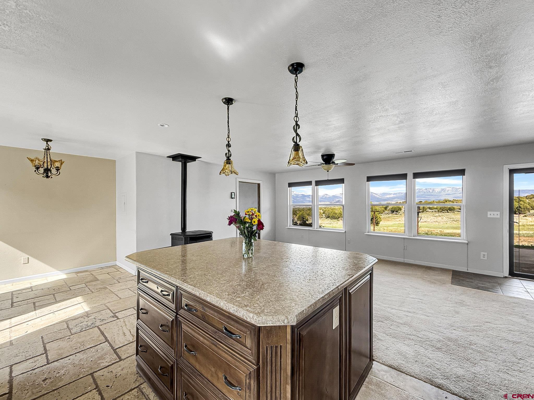 32310 B50 Road Crawford, CO 81415 - Photo 11 of 45 a kitchen with stainless steel appliances granite countertop a sink a oven and a wooden floor