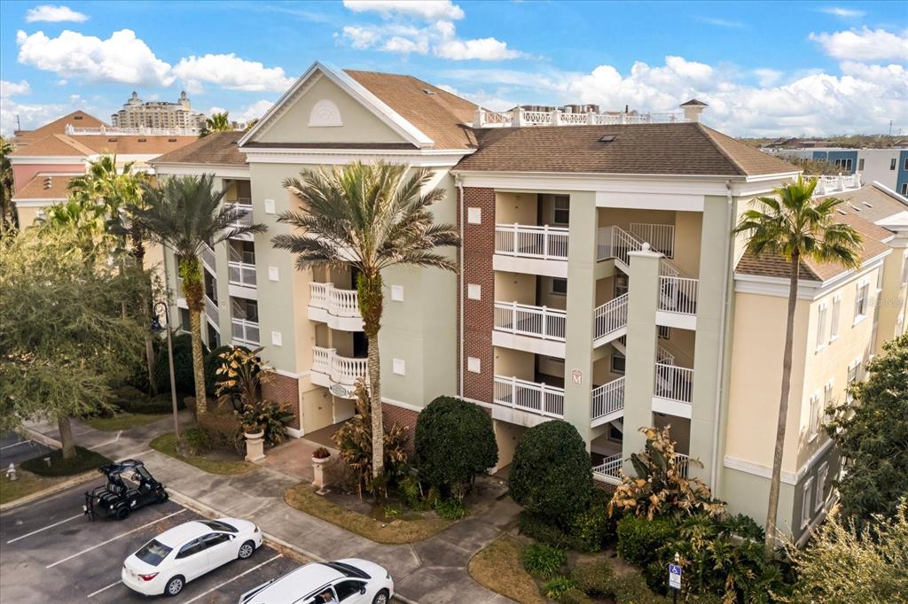 1114 Sunset View Circle, Unit 402 Reunion, FL 34747 - Photo 1 of 32 a front view of a house with a garden