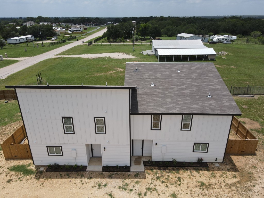 a aerial view of a house with a yard