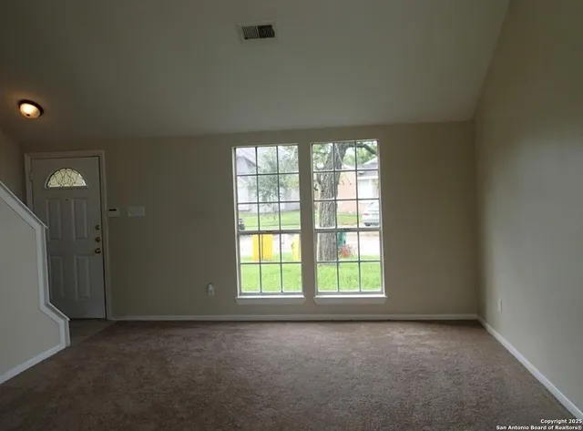 an empty room with windows