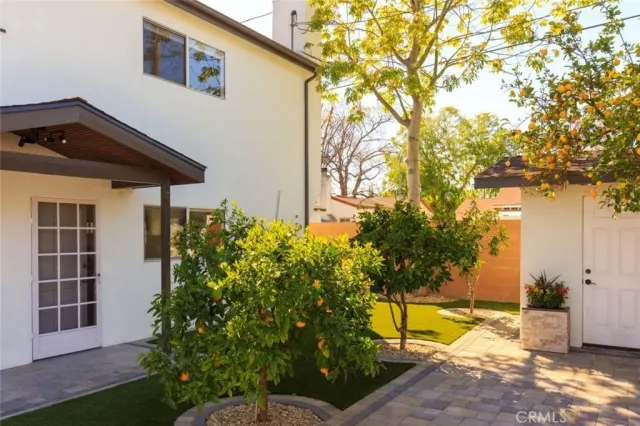 a wooden fence with trees in the background
